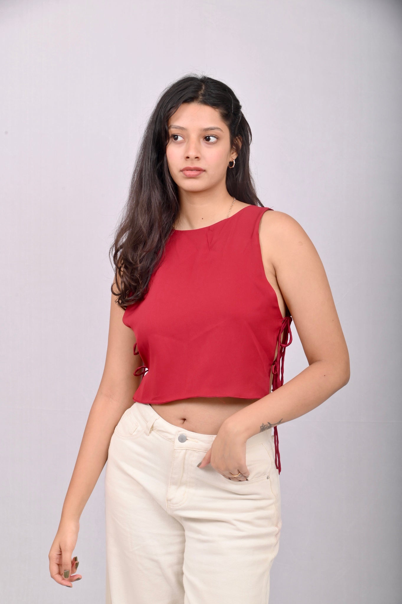 Red crop top with side tie laces. The top is freely sized. 